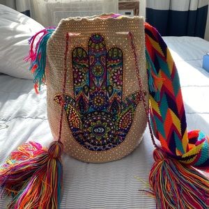 Multicolor shiny bag handmade using a unique technique and a special thread .